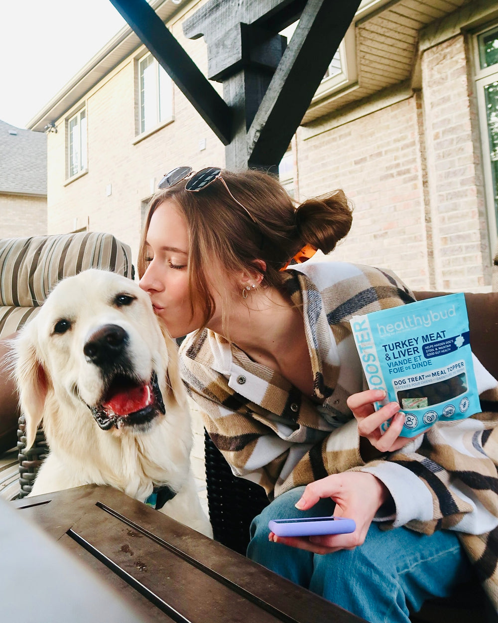 Girl and dog holding healthybud healthy dog treats image